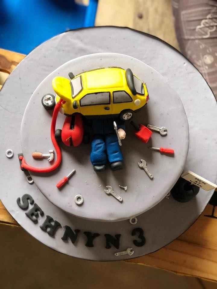 A toy car birthday cake for a three year old's birthday party