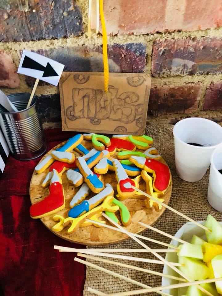 Kiddie's candy and cola on a table displayed for a kid's birthday party.