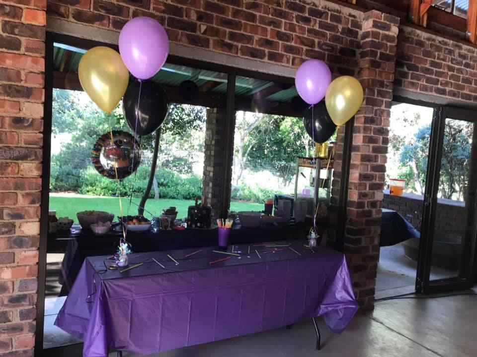 Setting up a food table for a kid's birthday party.