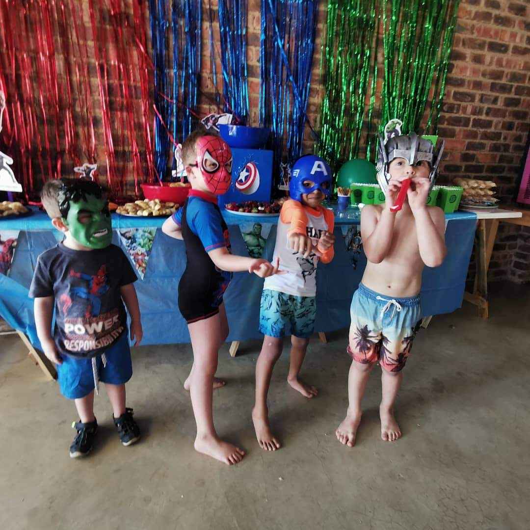 A group of kids in front of a decorated table at The Barn on Boundary Party Venue Johannesburg.