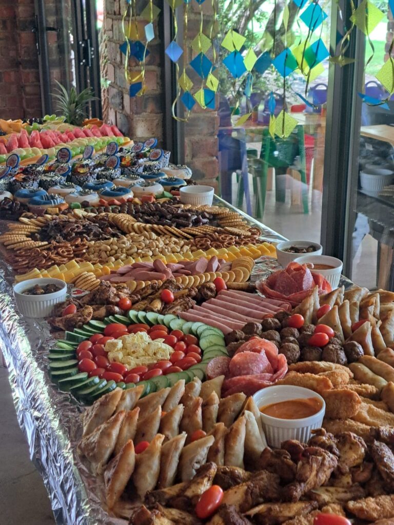 A lavish spread of assorted snacks and appetizers displayed on a table at the Barn on Boundary Party Venue in Johannesburg, Northriding.