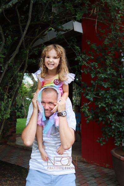 A young girl on her fatherβs shoulders at the Barn on Boundary Party Venue in Johannesburg, Northriding.