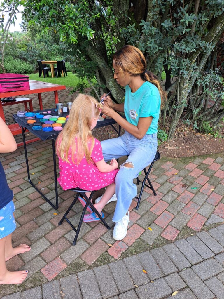 A child getting face painted at an outdoor event at the Barn on Boundary Party Venue in Johannesburg, Northriding.